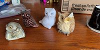 All four owl ornaments on table
