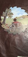 Full view of painted saw blade showing entire pastoral apple scene