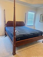 Full view of assembled four-poster bed with Serta iSeries mattress