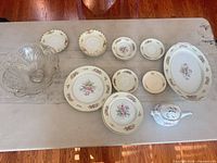 Full lot overview showing all china pieces and crystal bowl