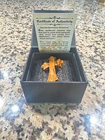 Brooch in box with certificate displayed