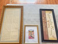All three framed pieces side by side