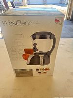 Front of sealed retail box showing product image and branding