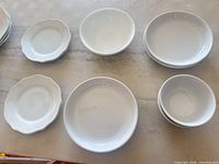 Assortment of plates and bowls laid out