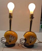 Both helmet lamps lit with bulbs installed