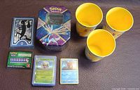 overview of cards, Xerneas tin, Pikachu cups, code cards, damage counter