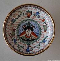 Top view showing interior portrait medallion, polychrome decoration and gilt rim