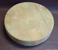 Top view of rawhide drumhead showing wear marks