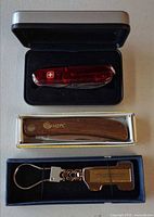 All three items in their respective cases and boxes