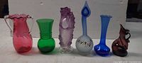 Front view of all six art glass pieces lined up