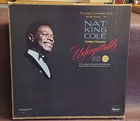 Front of box showing Nat King Cole portrait and title