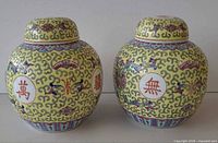 Front view of both ginger jars with lids showing overall pattern