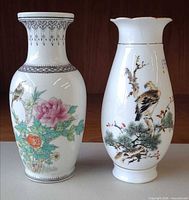 Front view showing both vases with painted designs