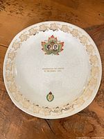Full view of plate showing shape, border design, central motif and inscription