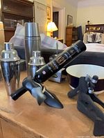 Overall lot showing shakers, thermos, duck wine holder, bowl, tools