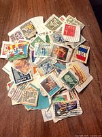 Pile of assorted Canadian and U.S. cancelled stamps