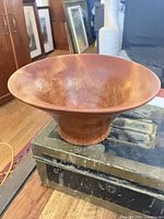 Oblique view of flared cherry burl bowl on foot