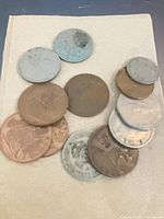Group of assorted copper and silver-colored vintage coins