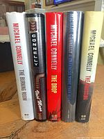 All five hardcover books standing spine-out