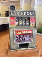 front view showing Las Vegas header, reels, coin drawer