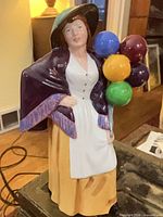 Front view of the Royal Doulton Balloon Lady figurine showing overall design and colours