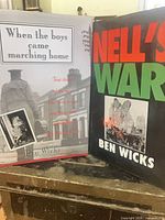 Both hardcover books standing side by side showing front dust jackets