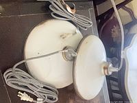 Both pendant lights showing shades, cords, plugs