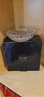 Crystal dish on top of original black Stuart box