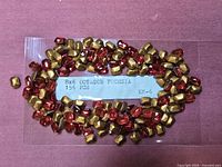 Bag of fuchsia octagon rhinestones with label showing 8x6, 156 pcs