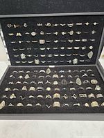 Entire open display case showing full ring collection