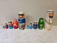 All nine nesting dolls lined up from smallest to largest