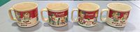 Front view of four Campbell's Kids ceramic mugs