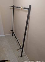 Full view of adjustable steel bed frame standing upright