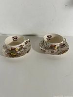 Both tea cup and saucer sets side by side