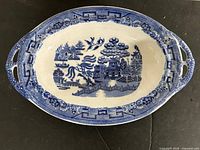 Top view of oval blue transferware platter with handles
