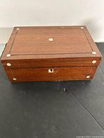 Closed box showing overall exterior and key escutcheon