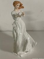 Front view of Royal Doulton “Thank You” figurine showing full figure, dress, and pose