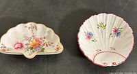Top view of both bone china dishes: left Royal Crown Derby Derby Posies shell dish, right Shelley scalloped floral dish