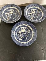 Three Churchill Blue Willow bowls displayed top view