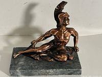 Full view of Achilles statue on marble base