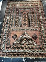 Full view of rectangular Persian rug showing overall design and colors