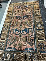 Full view of Hamedan wool rug showing pattern, colors and overall condition