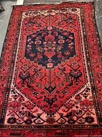 Full view of Persian Touserkan wool rug showing pattern and colors