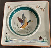 Top view of ashtray showing mallard design and cigarette rests