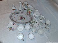Group shot of all bone china pieces on tablecloth