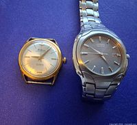 Front view of Citizen and Delbana watches side by side