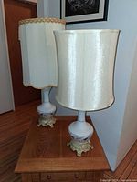 Front view of both porcelain lamps with shades