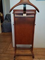 Rear angle highlighting wood panel back and side bars