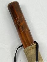 Close-up of eagle carving on handle section