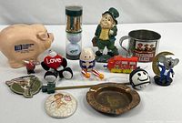 Full grouping showing all fourteen souvenir and collectible items